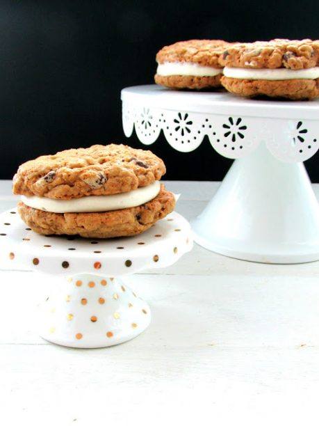 gluten free oatmeal creme pie on a cake plate with more on another cake plate 