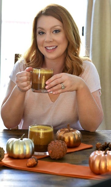 Dairy Free Pumpkin Spice Latte in a cup and being held by Jennifer