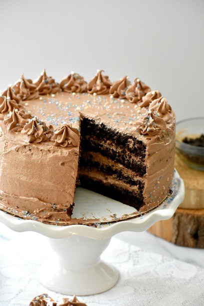paleo chocolate cake cut open on a cake plate