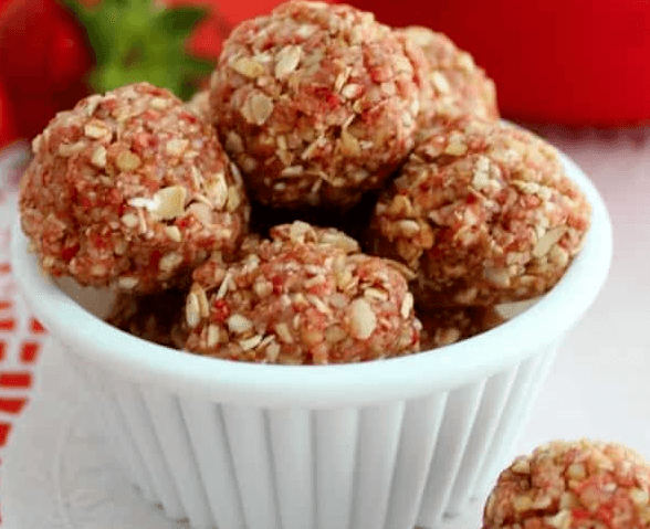 strawberry shortcake bites stacked in a bowl 