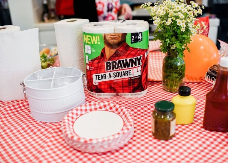 table with food plates, and paper towels