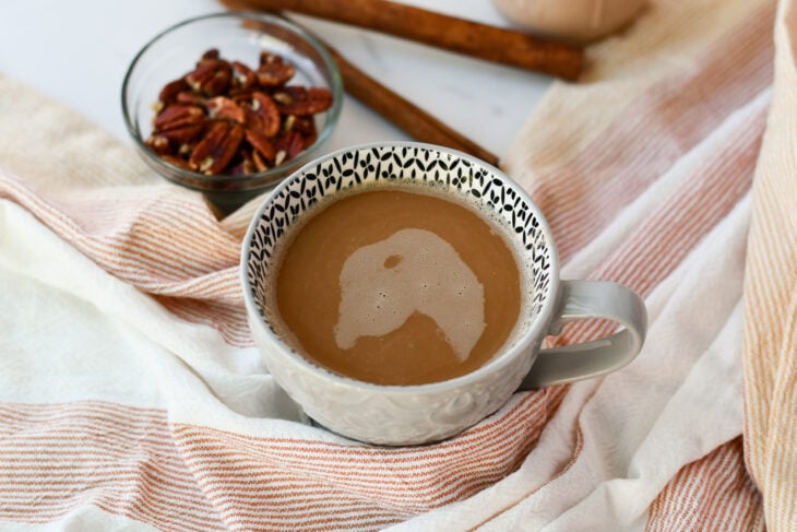 healthy coffee creamer in a cup of coffee with pecans