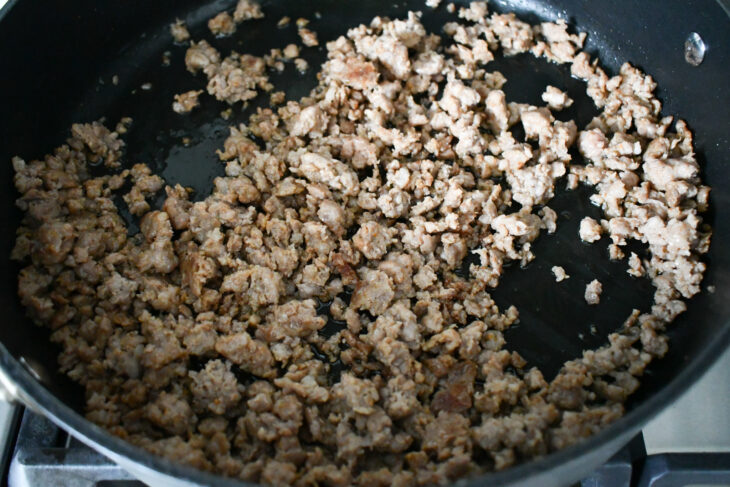 While the pasta is cooking, begin to brown your ground sausage. Set aside once cooked through.