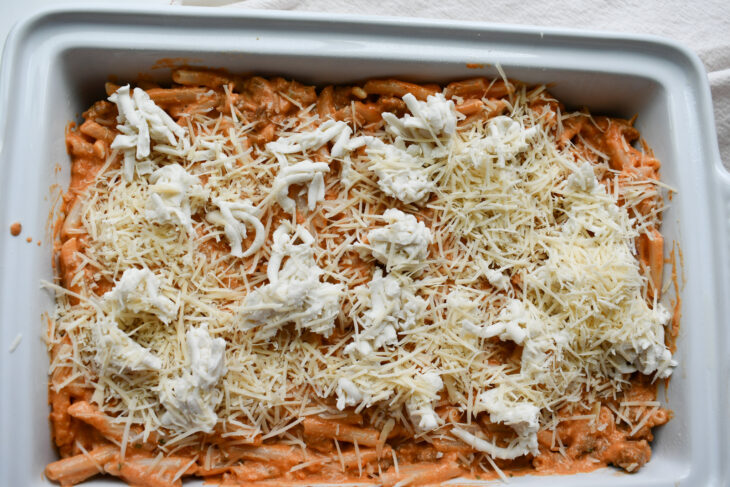 Add the rest of the pasta and sprinkle the remaining cheese on top of that.