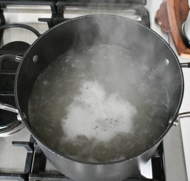 Start by cooking the noodles. In a large pot add 2 quarts of water and 1 tbsp of sea salt. Bring the water to a boil and then add the pasta. Stir well and bring to a boil. The cook time of the noodles is 10-15 minutes, mine took 12 minutes.