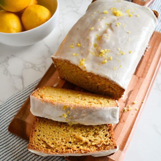 gluten free lemon loaf sliced to reveal a moist, tender crumb