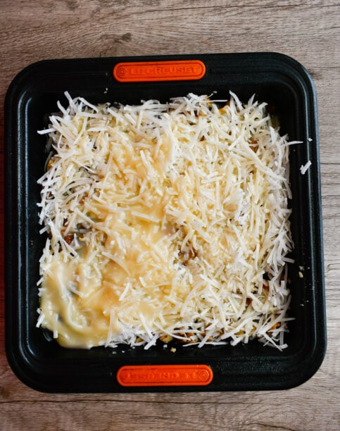 Pour the condensed coconut milk evenly over the entire pan.